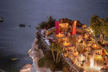 Terrace in front of the ocean. Restaurant with sea view at night.